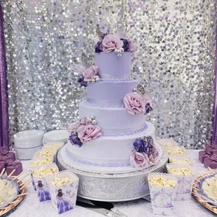 a wedding cake and cupcakes