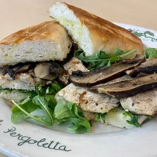CHICKEN PORTOBELLO PANINO:
Black label grilled chicken breast, sauteed Portobello mushrooms, and arugula.