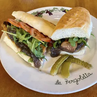 PANINO &amp; SALCICCIA Italian mild spicy grilled sausage, onion jam, tomatoes, arugula
