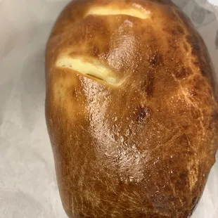 a loaf of bread on a piece of wax paper