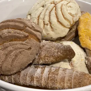 a bowl of ice cream and pastries