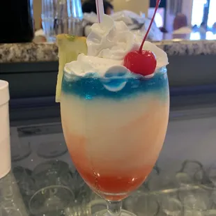 A friend of mine asked the bartender for this drink! Piña colada with big red  crazy but delicious!