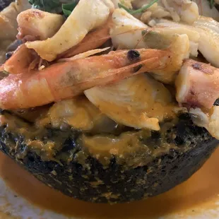 A big bowl of seafood in a delicious tomato and pepper stock.