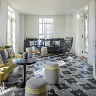 a living room with a marble floor