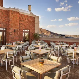 a patio with tables and chairs