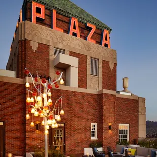 a patio with chairs and tables
