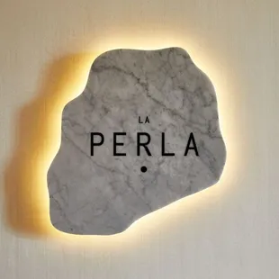 a rock with the word perla on it