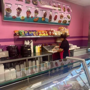 Putting sprinkles on the banana split