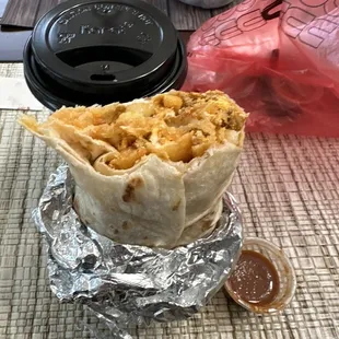 Chorizo breakfast burrito + spicy red sauce (salsa roja picante)