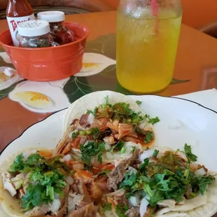 Carnitas tacos with soda in a mason jar