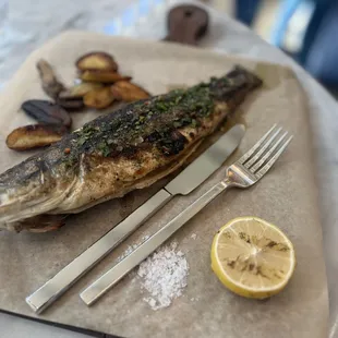 a plate of fish and potatoes