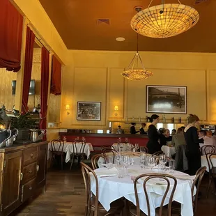 a dining room with tables and chairs