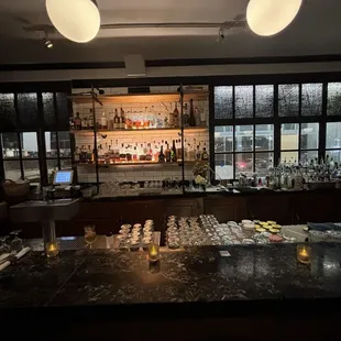 a bar with bottles of alcohol