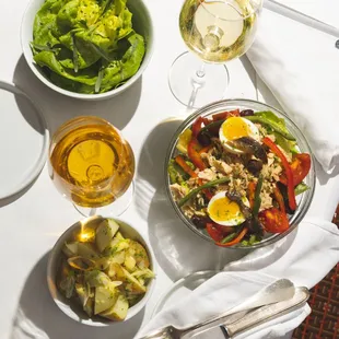 Under the Los Angeles sun, a bright Salade Niçoise, potato salad, and refreshing Salade Verte make for a vibrant and savory lunch affair.