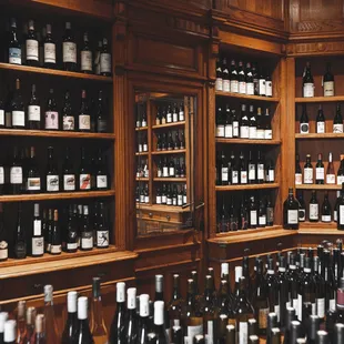 An array of top-notch Merlots, Chardonnays, Cabernets in a warm, inviting local wine shop.