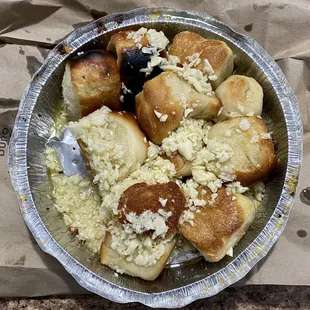 I received a bunch of burnt old dinner rolls drenched in oil, raw garlic and cheese when I ordered garlic knots. Disgusting!!