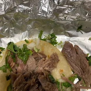 the meat and vegetables on the foil