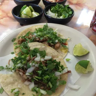All the fixings of a proper barbacoa and pollo taco