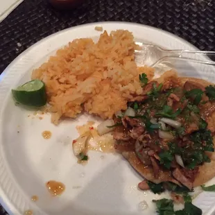 Asada taco with rice.