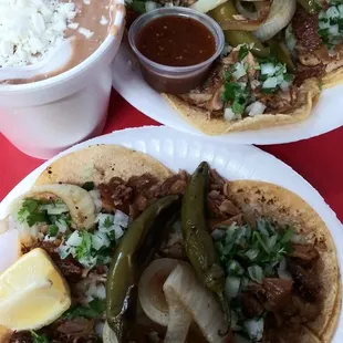 Carnitas tacos and with beans and cheese on the side. Amazing quality. Super fresh and full of flavor.