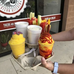 Mangonadas, dressed and plain, plus fruit cups and corn to go
