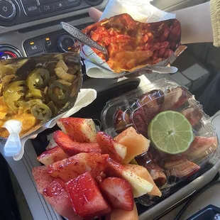 Frito pie with jalapeños, Hot Cheetos with cheese, medium fruit cup and a manzana loca