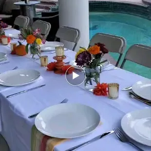 a table setting by the pool