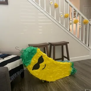a yellow pinata with mustaches