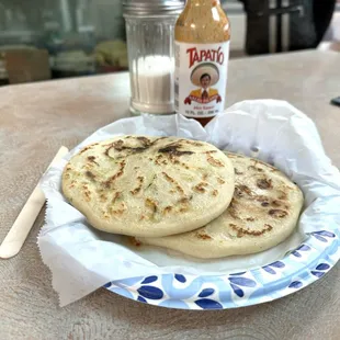 Two pupusas, queso con Loroco and chicharrón y queso