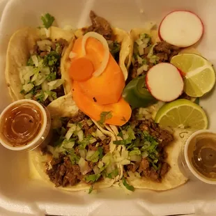 a white styrofoam container filled with food