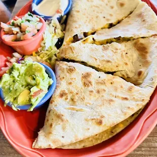 Carne asada quesadilla . With homemade guacamole and pico.