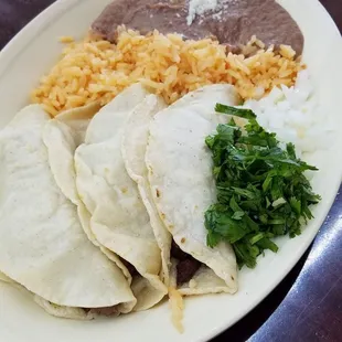 3 taco plate with beef fajita and homemade corn tortilla.