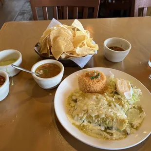 Chicken enchiladas it&apos;s green sauce and charro beans. Fantastic!