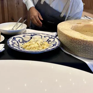 The fettuccine was made inside the cheese wheel