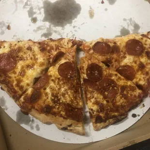 two slices of pepperoni pizza