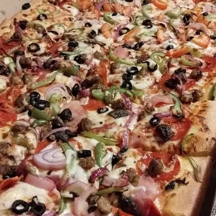 Mega Pizza (1/2 Vegetarian Specialty Pizza and 1/2 Loca Supreme Specialty Pizza).