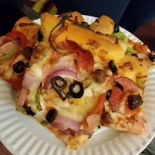 Slices of vegetarian pizza and combination pizza. Size of pizza was mega but half and half.