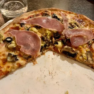 Sorry this isn't untouched, we were hungry! Their pizzas have an incredible thin crust and wonderful array of toppings. Delicious!!