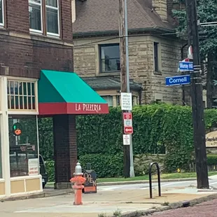 a fire hydrant in front of a restaurant