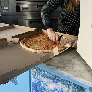 Cutting of our pie. Pineapple and ham!