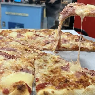 Pineapple and ham large up close. Look at that cheese drip