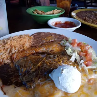 Number three; cheese and sour cream, chicken and mole, and birrio enchiladas, with rice and beans. Wonderful!