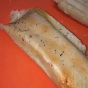 a piece of bread with a bite taken out of it