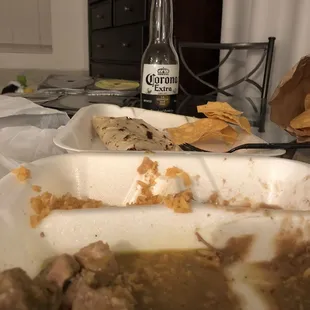 a plate of food and a bottle of beer