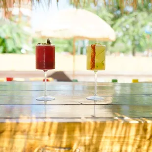 two cocktails on a table