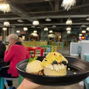 a person holding a plate of food