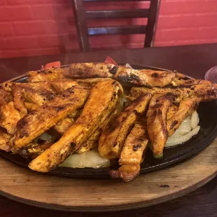 a plate of fries and a drink