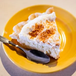 a slice of cake on a plate with a spoon