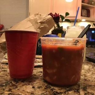 two cups of salsa on a counter