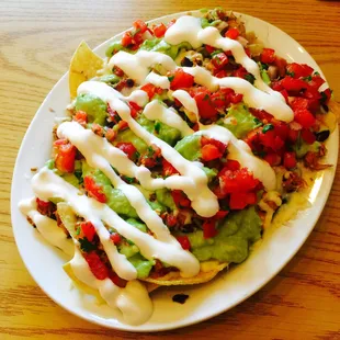 Nachos supreme with chicken.
